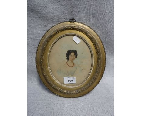A 19TH CENTURY PORTRAIT OF A YOUNG WOMAN wearing a coral necklace in an oval gilt frame