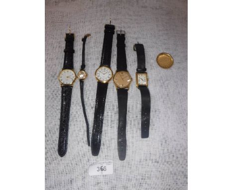 TISSOT: A gentleman's 18K yellow gold wristwatch, the round dial with dot and baton numerals and sweep seconds hand, attached