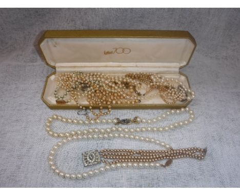 A CULTURED PEARL CHOKER and a collection of simulated pearl necklaces