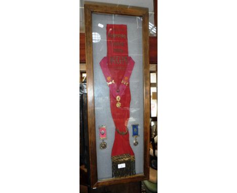 MASONIC INTEREST: A SASH from the 'Kempsford Lodge 7974' and related regalia in a box frame