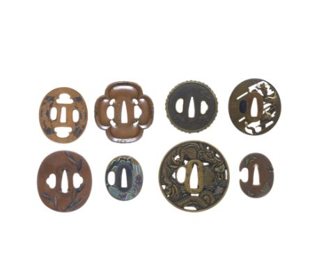 EIGHT TSUBA (HAND GUARDS)Edo period (1615-1868), 18th to 19th centuryThe first circular, brass with traces of enamel, chisell