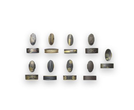 NINE FUCHI-GASHIRA (HILT COLLARS AND POMMELS)Edo period (1615-1868), 18th to 19th centuryThe first iron, inlaid and overlaid 