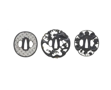 THREE TSUBA (HAND GUARDS)Edo period (1615-1868), 18th to mid-19th centuryAll shakudo, the first ovoid, finely cut in itozukas