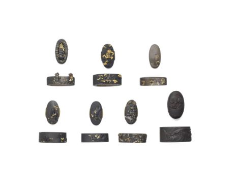 SEVEN FUCHI-GASHIRA (HILT COLLARS AND POMMELS)Edo period (1615-1868), 18th to 19th centuryThe first iron, chiselled in relief