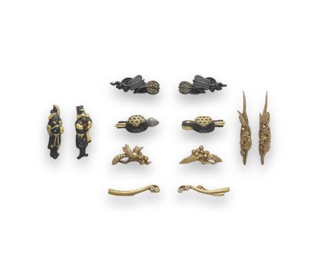 SIX SETS OF MENUKI (HILT GRIPS)Edo period (1615-1868), 19th centuryThe first gold, as sheaves of autumn plants; the second sh