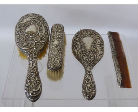 A Lady's Silver Dressing Table Set, including hairbrush, mirror, clothes brush and comb. (af), Birmingham hallmark, dated 190