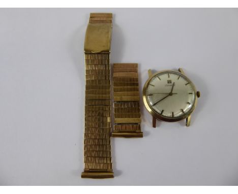 A Gentleman's 9ct Gold Vintage Tissot Wrist Watch together with a 9 ct gold strap, the watch having a silvered face with bato