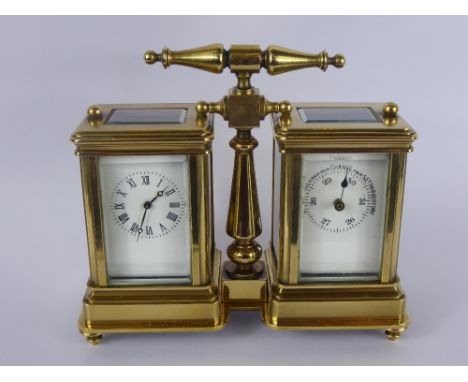 A Twin S & F Brass Desk Carriage Clock and Barometer, with enamel face and Roman dial, complete with key.