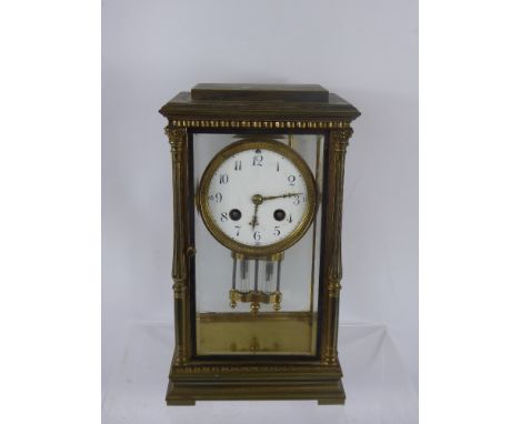 A French Gilt Brass Four-Glass Mantel Clock, eight-day movement with mercurial pendulum, white enamel dial approx 10 cms, Jap