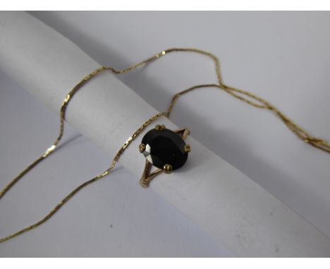 A Lady's 9ct Gold Necklace, approx 1.3 gms, together with a 9 ct gold garnet ring, 10 x 8 mm,  size K, approx 1.7 gms.