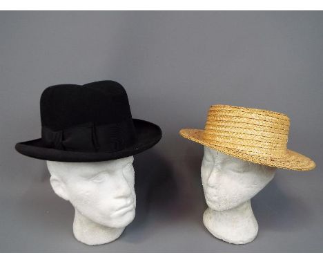 Two vintage hats comprising a G A Dunn &amp; Co London homburg (approximately 60 cm internal circumference) and a straw boate