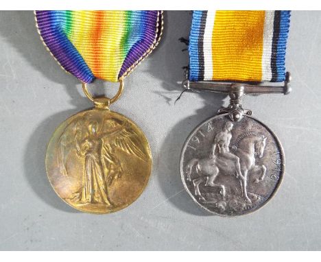 A WWI medal pair comprising Victory Medal and British War Medal, named to 200271 A. SJT. H. ACKROYD. S. LAN. R.