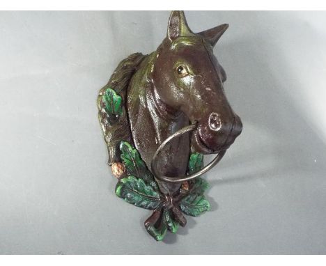 A cast horse head door knocker (XHHD)