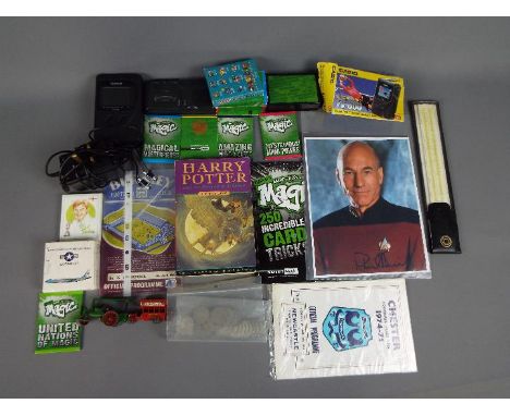 A mixed lot of collectables to include a Casio TV-600 LCD colour television, card trick set, small quantity of diecast includ