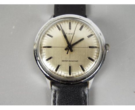 A gentleman's Timex wristwatch with leather strap.