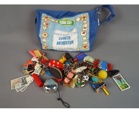 Key-rings - A Sesame Street, Cookie Monster material bag containing a vintage key-ring collection in excess of 40, all variou