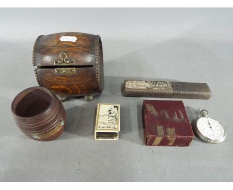 A collection of military related items to include match box cover Smiths stop watch 1/5 sec contained in a U.S Army Ordnance 