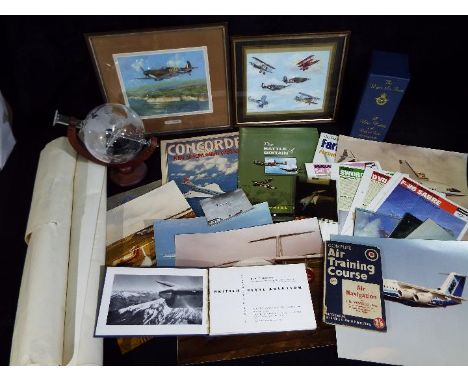 A collection of aviation related items including framed prints, The Royal Air Force A Video History, posters, Air Training Co