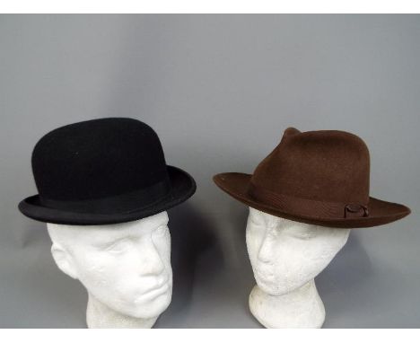 Two vintage hats comprising a Harrods of London bowler hat (approximately 59 cm internal circumference) and a Christys of Lon