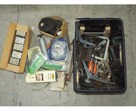 A large tub containing a quantity of clamps, hinges, a boxed corner cramp, tools, steel wool, a box of 320mm multi truss hang