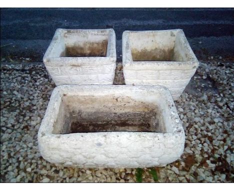 A matched pair of reconstituted stone square planters and a rectangular stone planter  (3)