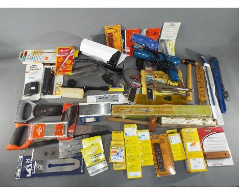 A good quantity of hands tools including Yankee #130A Spiral Ratchet Screw Driver; a Bulldog Raw Hide Roll Mallet;a Heathkit 