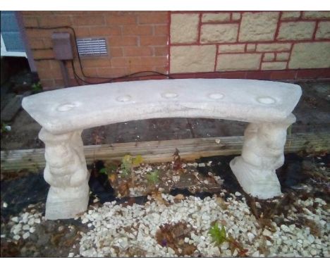 A reconstituted stone garden bench decorated with squirrel supports 