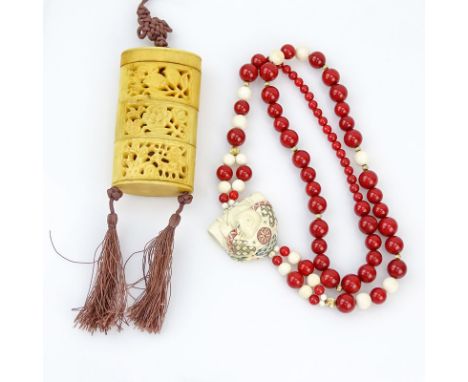 Grouping of Two (2) Japanese Jewelry Items. Includes: antique Japanese reticulated carved bone inro on cord, single strand re