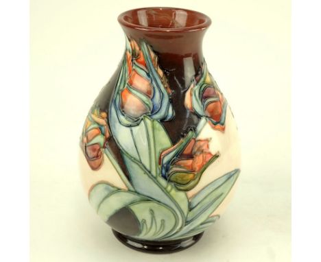 Moorcroft Pottery Vase. Tulip motif. Signed. Light crazing or in good condition. Measures 7-1/2" H. Shipping $42.00 (estimate