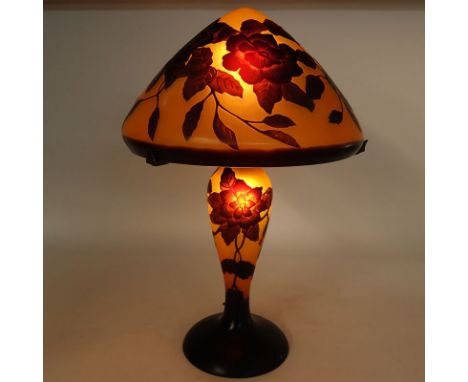 After: Emile Galle, French (1846-1904) Art Nouveau Cameo Glass Lamp. Orange and brown color ground with raised flower relief.