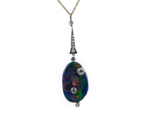 Art Nouveau Australian Free Formed Black Opal, European Cut Diamond, Platinum and 14 Karat Yellow Gold Pendant with 14 Karat 