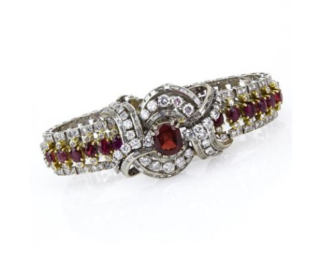 Retro Circa 1940s Ruby, Round Brilliant and Baguette Cut Diamond, Platinum and 18 Karat Yellow Gold Bracelet. Rubies with viv