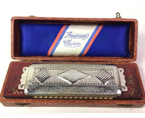 THE UP TO DATE VERY BEST TREMOLO CONCERT HARP, BY M. HOHNER in original case, along with a pokerwork 'book' box with sliding 