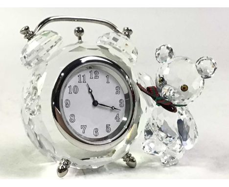 GROUP OF SWAROVSKI CRYSTAL FIGURES, including a teddy bear with alarm clock, swan, black swan SCS paperweight, mini seal and 