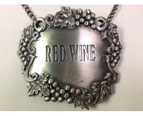 COLLECTION OF DECANTER LABELS, including ceramic and white metal examples