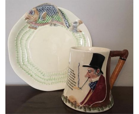 Clarice Cliff moulded plate with fish decoration and a Crown Devon musical jug