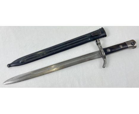 A vintage M/27 bayonet with scabbard for Mosin Magrant by Fiskars, Finland. With wooden grips. Total length with scabbard app
