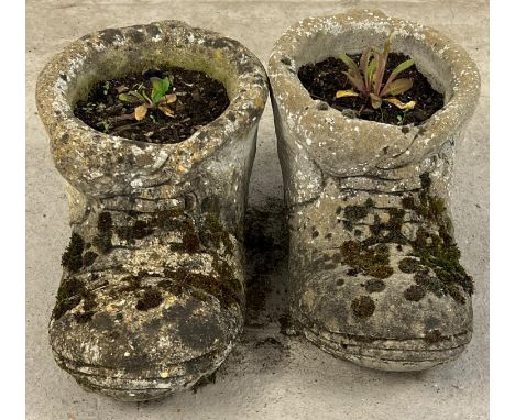 A pair of large vintage concrete garden planters modelled as boots. Each approx. 23cm tall x 44cm long. 