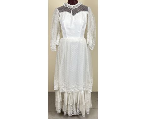 A vintage 1970's lace layered dress with angel sleeves and high neck. 