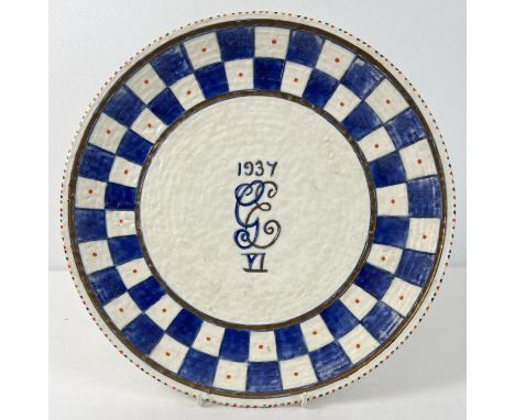 A Crown Ducal George VI Coronation ware charger by Charlotte Rhead. Blue and white checkerboard pattern with 1937 GE VI detai