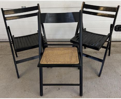 2 vintage wooden folding chairs with slated wooden seats, together with another folding chair with a cane seat. All in a blac