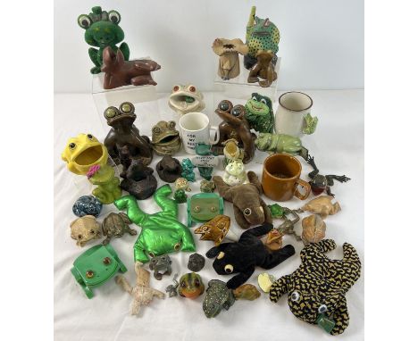 A large collection of frog figures, ornaments, mugs and beanbags. To include studio pottery, wooden, fabric and resin. 