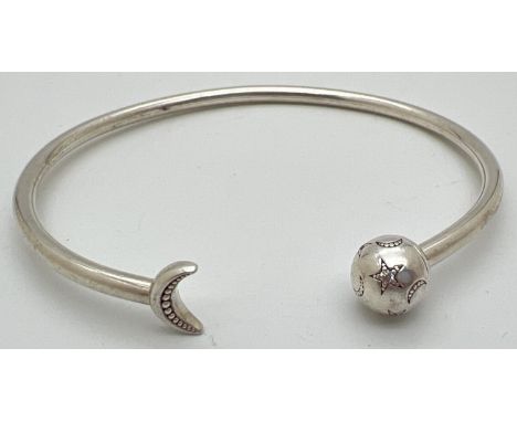 A silver star and moon stone set bangle by Pandora. Pandora silver marks to inside of bangle and to ball end. Approx. 6.5cm a