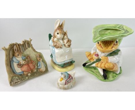 4 ceramic and resin Beatrix Potter collectables. A large ceramic Jeremy Fisher jug and Mrs Rabbit moneybox both by Border Fin