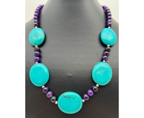 An 18" costume jewellery necklace of Chinese turquoise and purple jasper beads. With silver tone S shaped clasp. Jasper beads