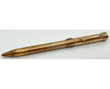 A vintage gold plated on silver Super-Norma Mecan multi coloured propelling pencil. Engine turned decoration throughout. Top 