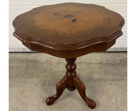 A vintage ornate tripod occasional table with inlaid floral design to top and shaped rim. Approx. 61.5cm tall x 54cm diameter