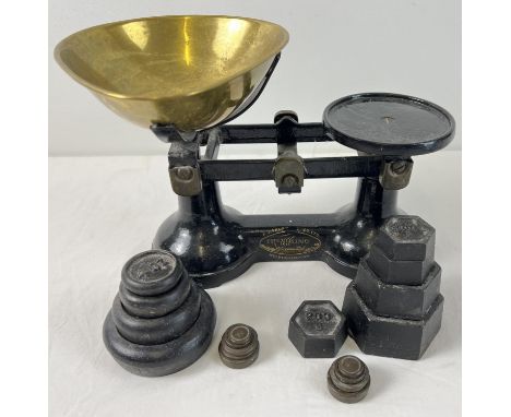 A vintage set of black painted 'The Viking' kitchen scales with brass bowl and a selection of assorted weights. 