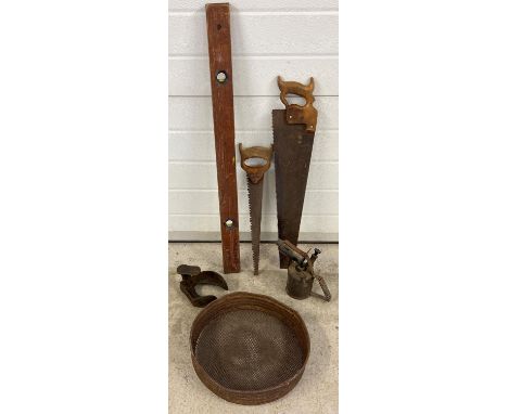 A collection of vintage tools, to include Primus No. 632 blow torch, Rabone wooden level, metal sieve and wooden handled saws