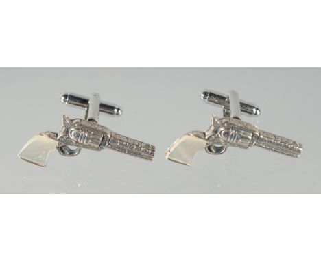 A PAIR OF SILVER AND MOTHER OF PEARL PISTOL CUFFLINKS
